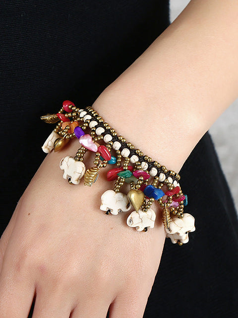 Pulsera turquesa tejida con elefante bohemio para mujer